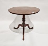 George III oak tilt-top dining table of circular form, raised on tripod cabriole legs  Condition