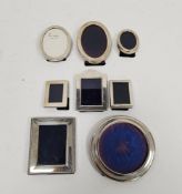 Collection of silver-mounted photograph frames of various sizes and shapes, to include one by
