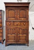 Georgian oak Welsh cupboard, the top section with double panelled cupboard doors enclosing shelves