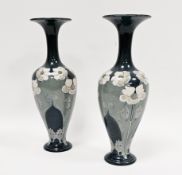Pair of late 19th century Lambeth Doulton faience blue ground Art Nouveau baluster vases, painted
