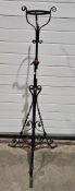 Victorian Arts & Crafts wrought iron adjustable lamp stand, of tripod form, applied with copper