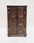 Antique oak side cabinet having two shelves enclosed by pair framed panel doors, all with lozenge
