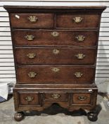 Georgian oak chest on stand, the moulded top above two short drawers and three long graduating