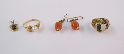 Gold-coloured metal, opal and emerald dress ring set oval opal, two rows of small emeralds in