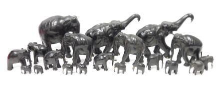 Collection of ebony and bone-mounted models of elephants in sizes, each naturalistically carved