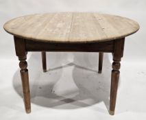 20th century pine extending dining table having one additional leaf, raised on four turned legs,