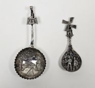 Dutch silver embossed spoon with deep bowl and a similar white metal caddy spoon with moving