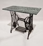 Cast iron Singer sewing machine treadle base, adapted into a side table, with a marble top, 75cm