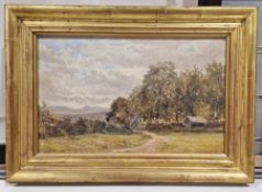 L Trevor Oil on panel River landscape with boats moored, signed lower right, framed, 19cm x 35cm,