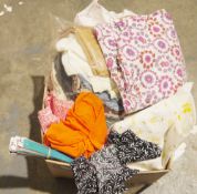 Assorted fabrics and dressmaking accessories to include a quantity of nylon zippers, assorted