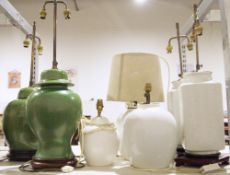 Two green ceramic lamps on wooden bases, both converted from lidded vases, two white ceramic