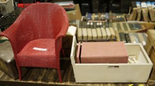 Lloyd Loom chair, similar crib and washing basket, the chair and washing basket painted red, the