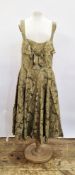 1950's green satin printed cocktail dress, ruched bodice, broad sleeves, bow detail to the front,