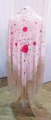 Chinese embroidered silk piano shawl, allover floral decorated on a pale salmon pink ground and with
