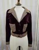 A blue and white printed cotton shift dress. a brown velvet bomber jacket with brown and gold