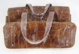 Leather skin-effect holdall in brown with various compartments