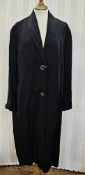 A mustard coloured crepe wool full length fitted coat circa 1940s raglan sleeves button fastening to
