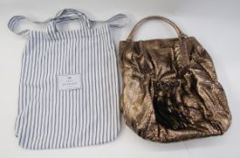 Anya Hindmarch metallic python shoulder bag with front pocket, bow and tassels, suede lining, having