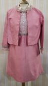 A 1960s cocktail outfit, pink satin, the bodice embroidered with translucent thread, silver braid to