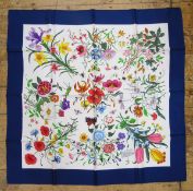 Two Gucci printed silk scarves, allover floral decorated (2)