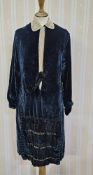 A 1920s blue velvet dress, with embroidered detail, embroidered fastening, a silk insert with
