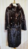 Full-length black mink coat circa 1980's, half-belt, with gilt and faux amber button detail,