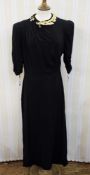1940's black crepe dress, pintuck detail to one side and to one shoulder, metal laurel leaf