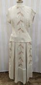 1940s skirt with matching blouse top, the skirt and jacket embroidered and with appliqued flowers,