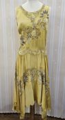 A 1920s rust coloured silk dress pin tucked pleats to the front panel, with side frill and mother of