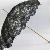 Late 19th/early 20th century parasol with a carved wooden handle as bamboo, black lace with a