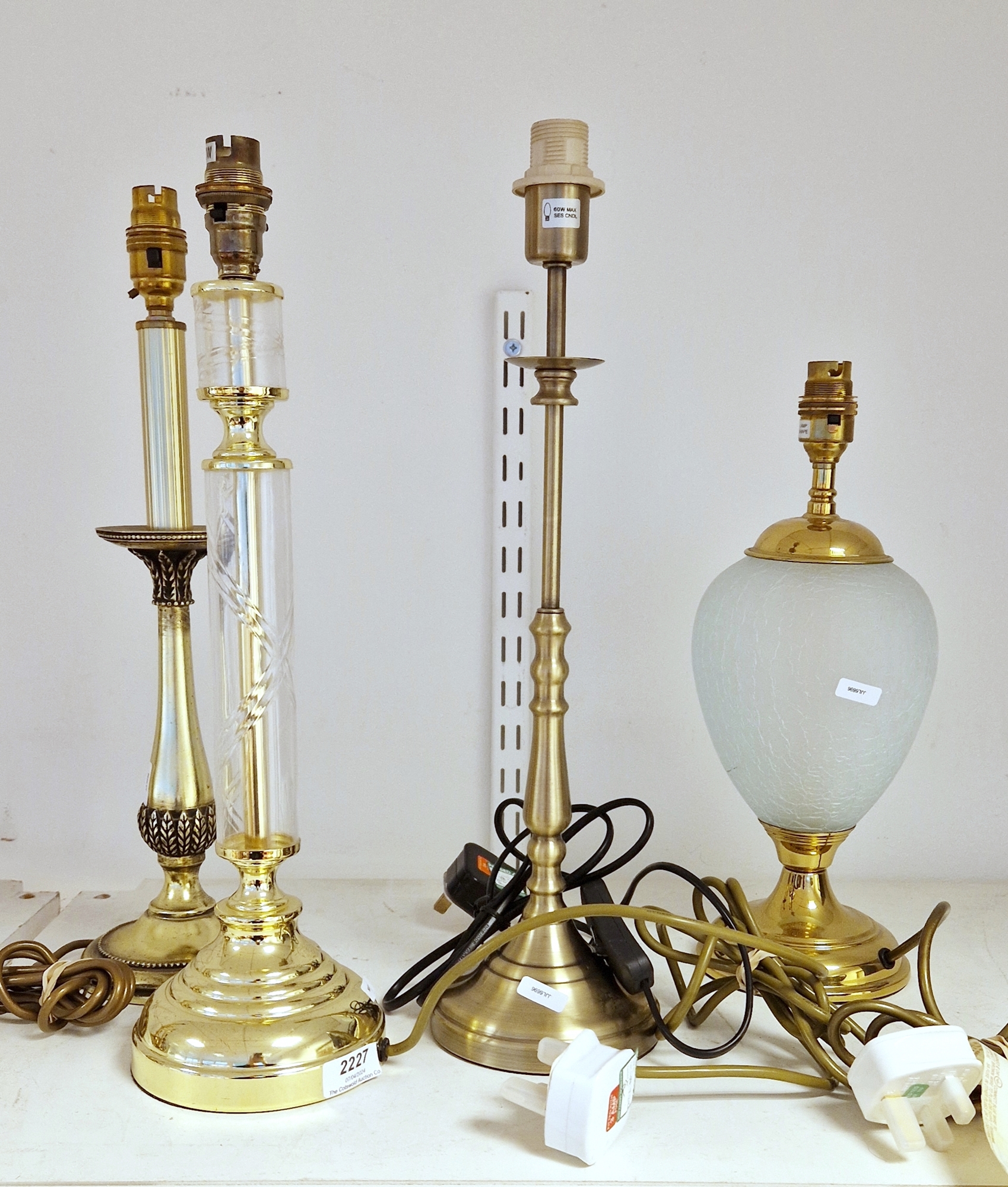 Four contemporary table lamps, comprising: a gilt-metal and frosted cracked ice pattern oviform