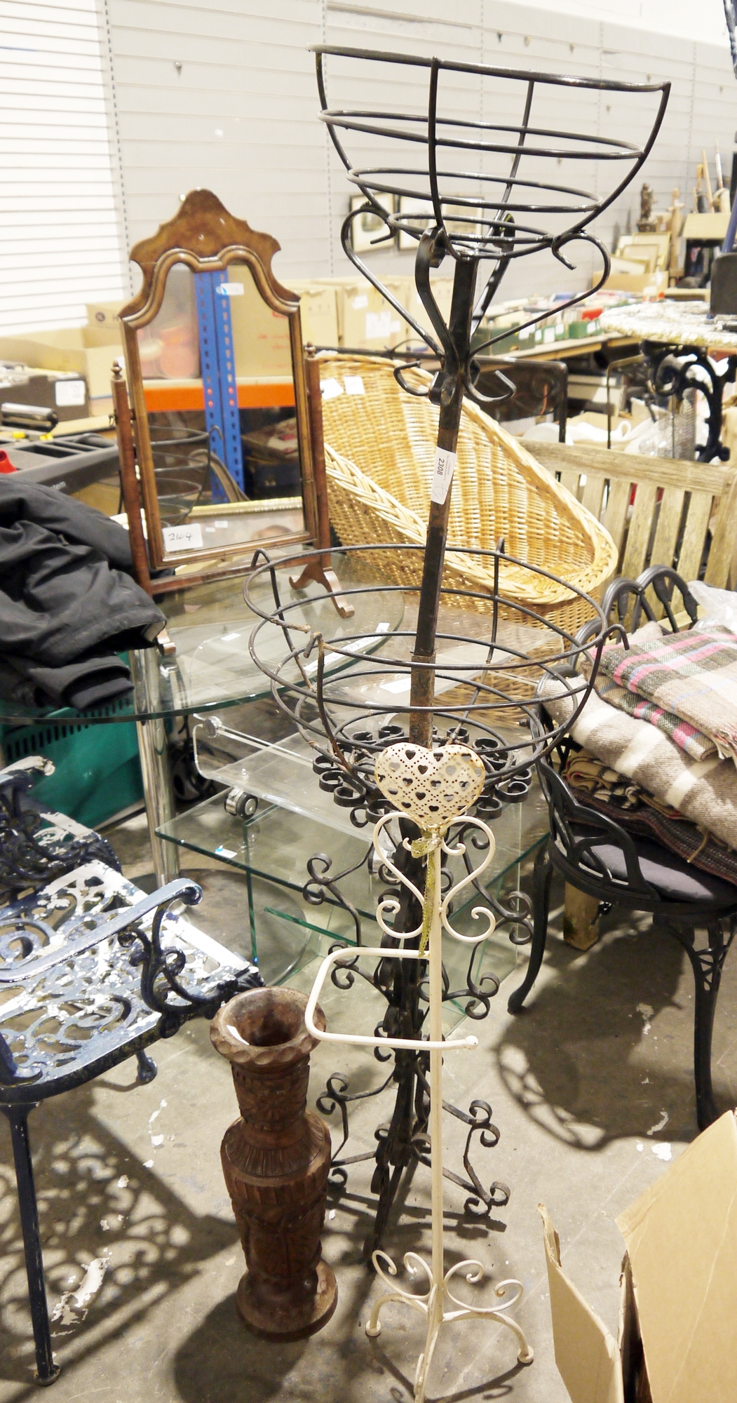 Metal garden jardiniere on a scrolled support, another, a white metal heart loo roll holder, and a