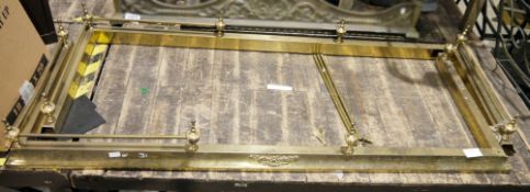 Pair of brass fenders topped with bars between urn finials Condition Report height 19cm width