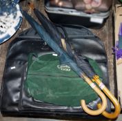 Two golf umbrellas, one Mandarin Oriental Group, the other 'Oriental Express', a black leather