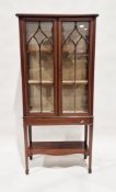 Edwardian mahogany display cabinet with inlaid decoration throughout, the two glazed doors opening