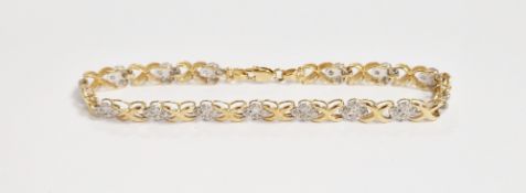 10K gold and diamond bracelet having four diamond chips, illusion set, interspersed by 'X' links