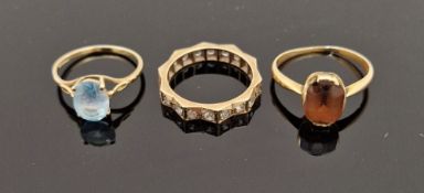9ct gold and blue stone set ring and a 9ct gold, a white stone set eternity ring and a gold-coloured