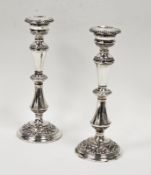 Pair of Elizabeth II silver candlesticks embossed scrolling and acanthus motifs, Birmingham 1966