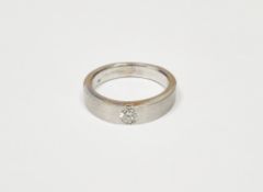 18ct white gold solitaire diamond ring, the plain brushed metal band, flush set with single stone,