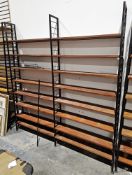 Mid century Ladderax three-section shelving unit comprising three black painted metal frames and