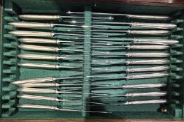 A large matched set of Victorian silver flatware for twelve, including table knives, forks, spoons