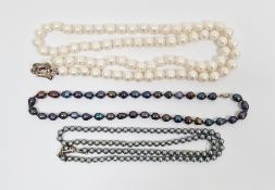 Long string of modern white pearls and two strings of grey pearls  Condition Report String of