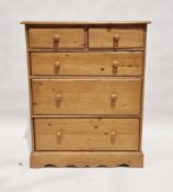 20th century pine chest of drawers having two short over long drawers, each with turned wooden