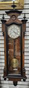 19th century Vienna-style walnut regulator clock, with a white enamel dial, with black Arabic