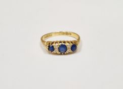 18ct gold, sapphire and diamond ring set three graduated sapphires alternating with two pairs tiny
