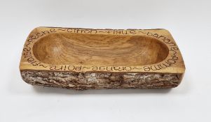 Carved oak fruit bowl by Maxim Hastings, signed to base, the the form of a hollowed branch,