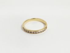 Gold-coloured metal and diamond half-eternity ring