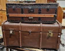 Large wood and metal bound steamer trunk, the lid opening to reveal a fitted interior, with two