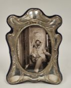 A silver mounted Art Nouveau style oval photograph frame, velvet easel back, approximately