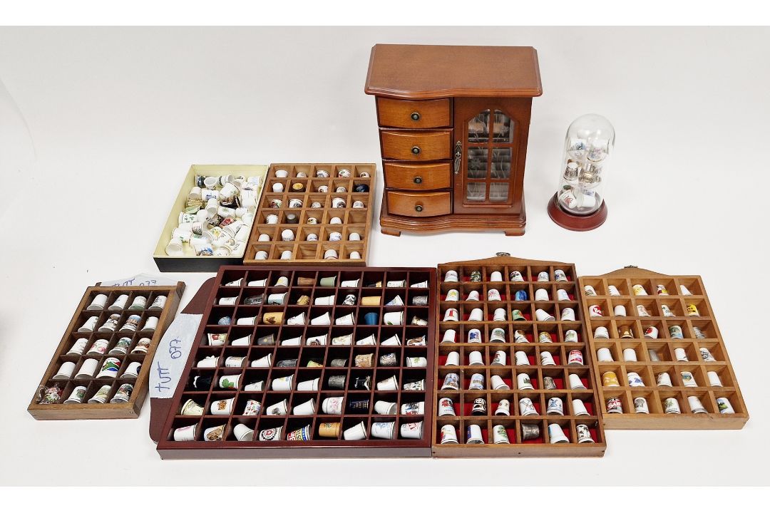 A collection of ceramic thimbles  within various fitted display cases, a wood jewellery box, - Image 1 of 2